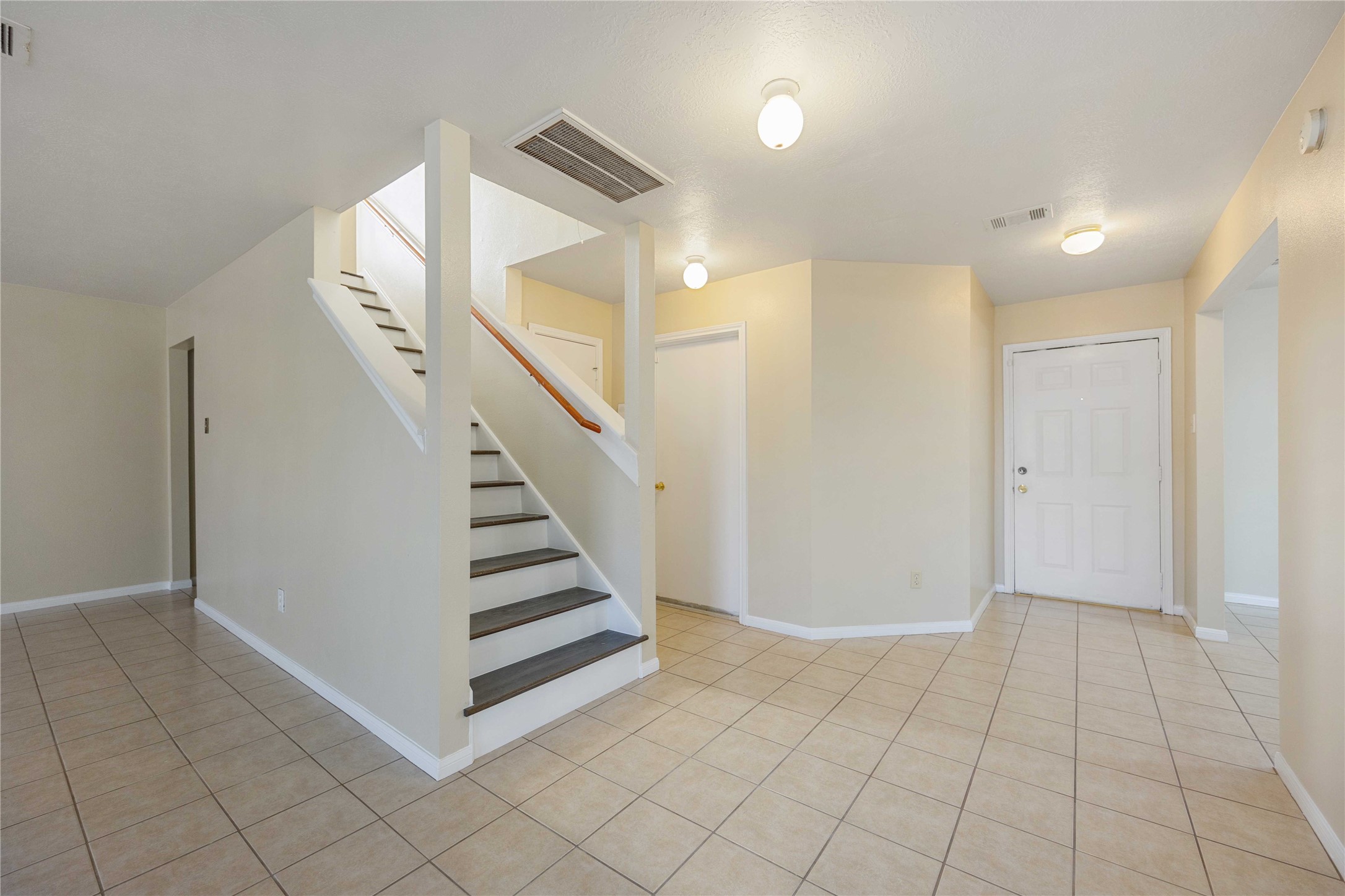 4806 Cotton Ridge Trail Houston, TX 77053 - Photo 3 of 25 a view of a livingroom with white walls and stairs