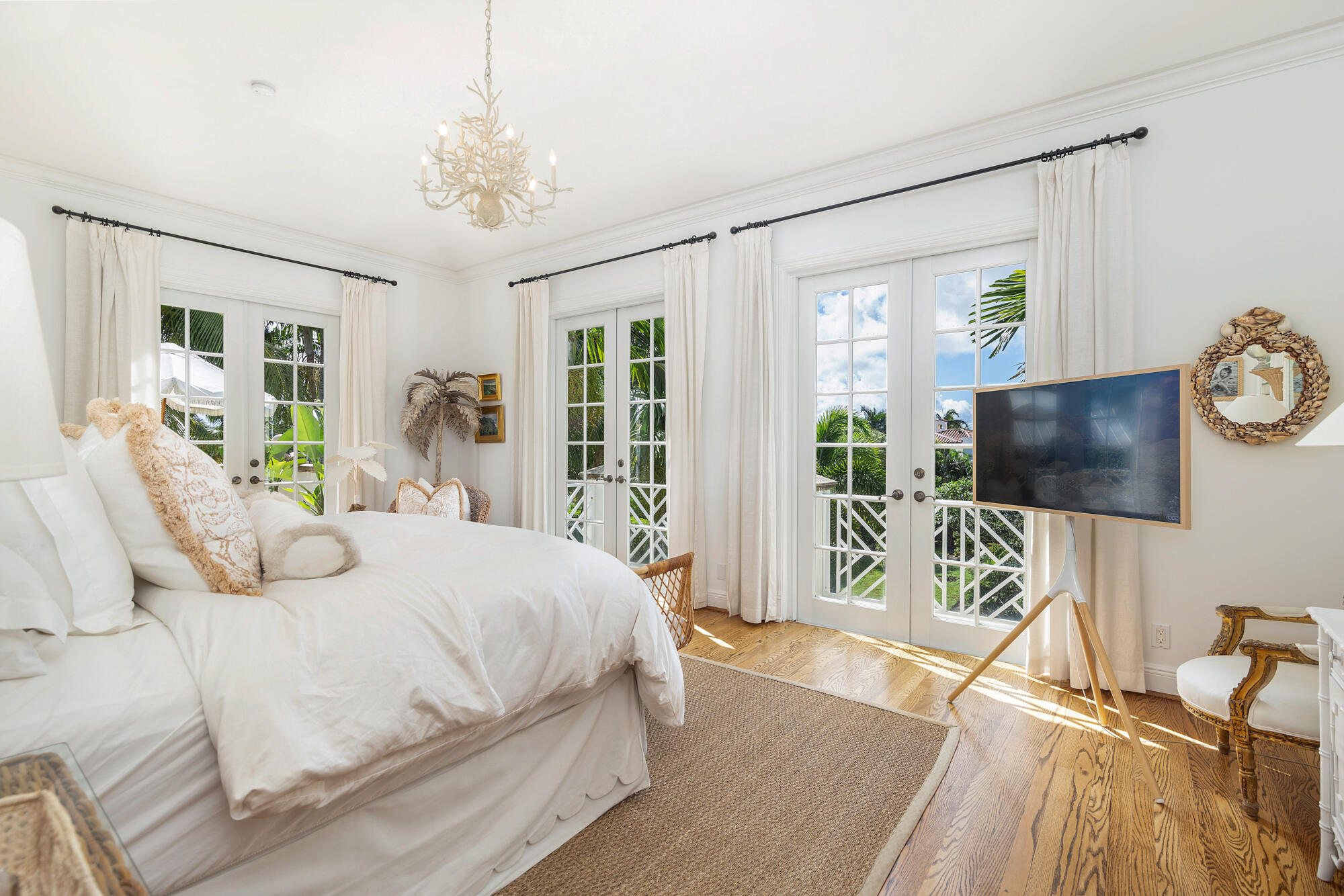 119 Alpine Road West Palm Beach, FL 33405 - Photo 16 of 30 a bedroom with a bed and a flat screen tv on the dresser