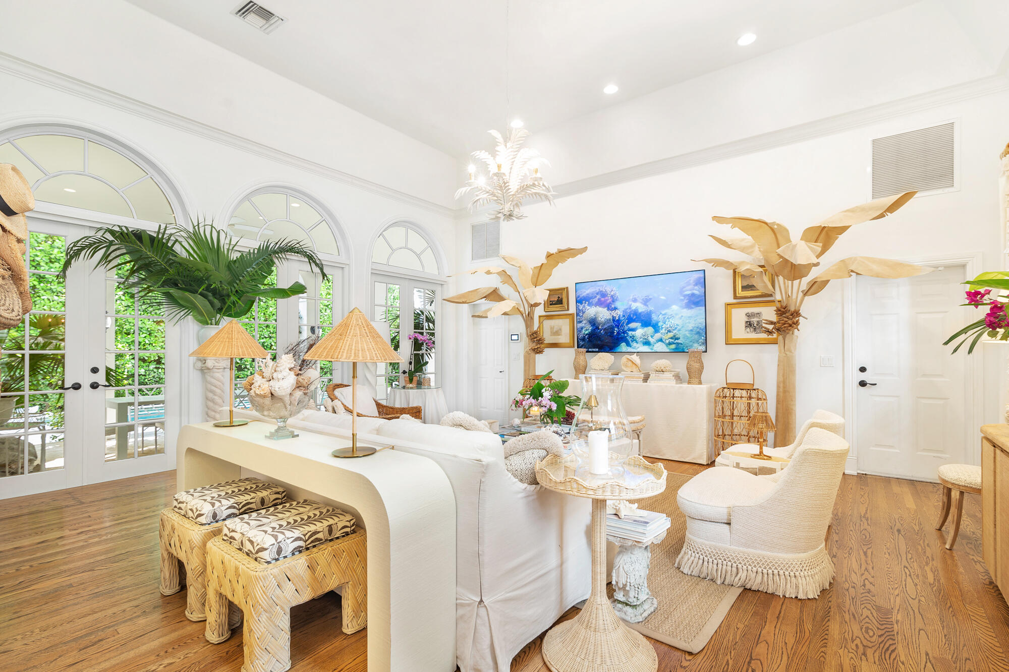 119 Alpine Road West Palm Beach, FL 33405 - Photo 4 of 30 a living room with furniture and a chandelier