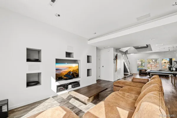 a living room with a flat screen tv and a couch