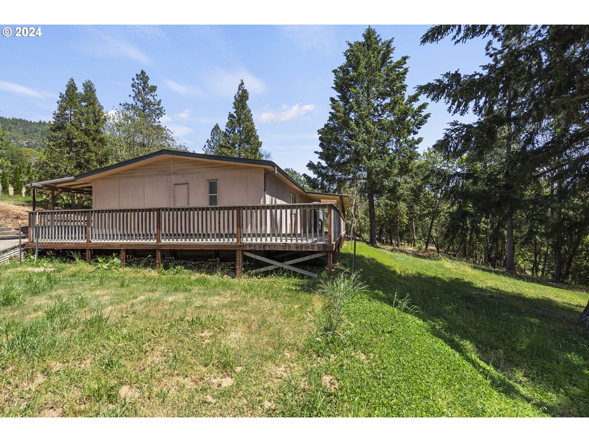 10244 North Applegate Road Grants Pass, OR 97527 - Photo 15 of 24 a view of a house with a yard