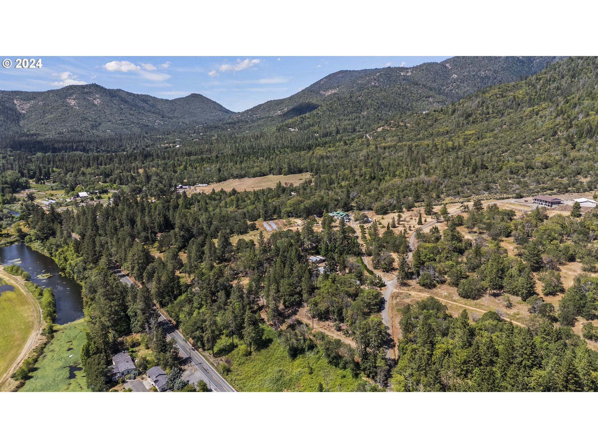 10244 North Applegate Road Grants Pass, OR 97527 - Photo 22 of 24 a open area with mountains in the background