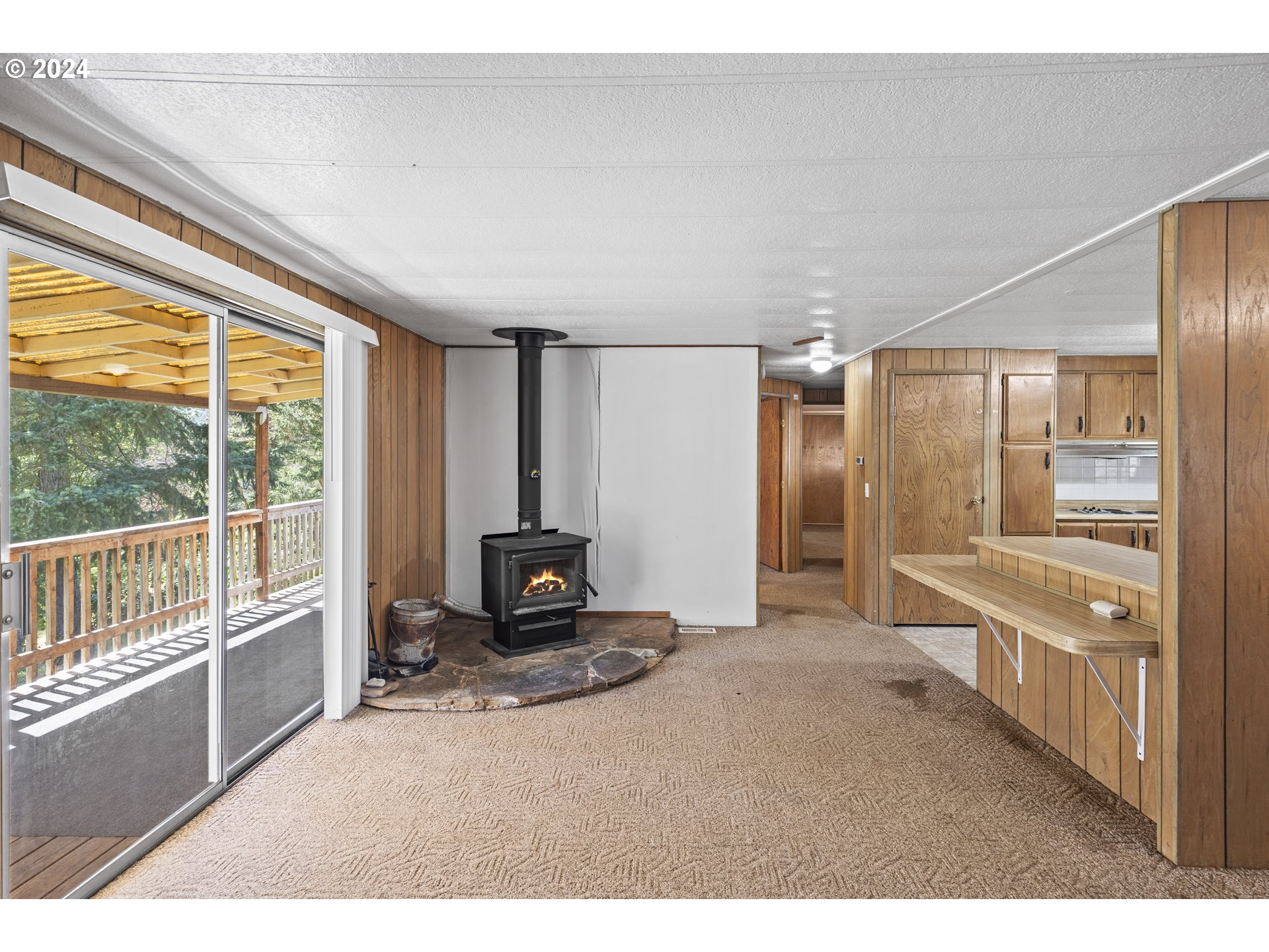 10244 North Applegate Road Grants Pass, OR 97527 - Photo 6 of 24 a spacious bedroom with a large window and a balcony