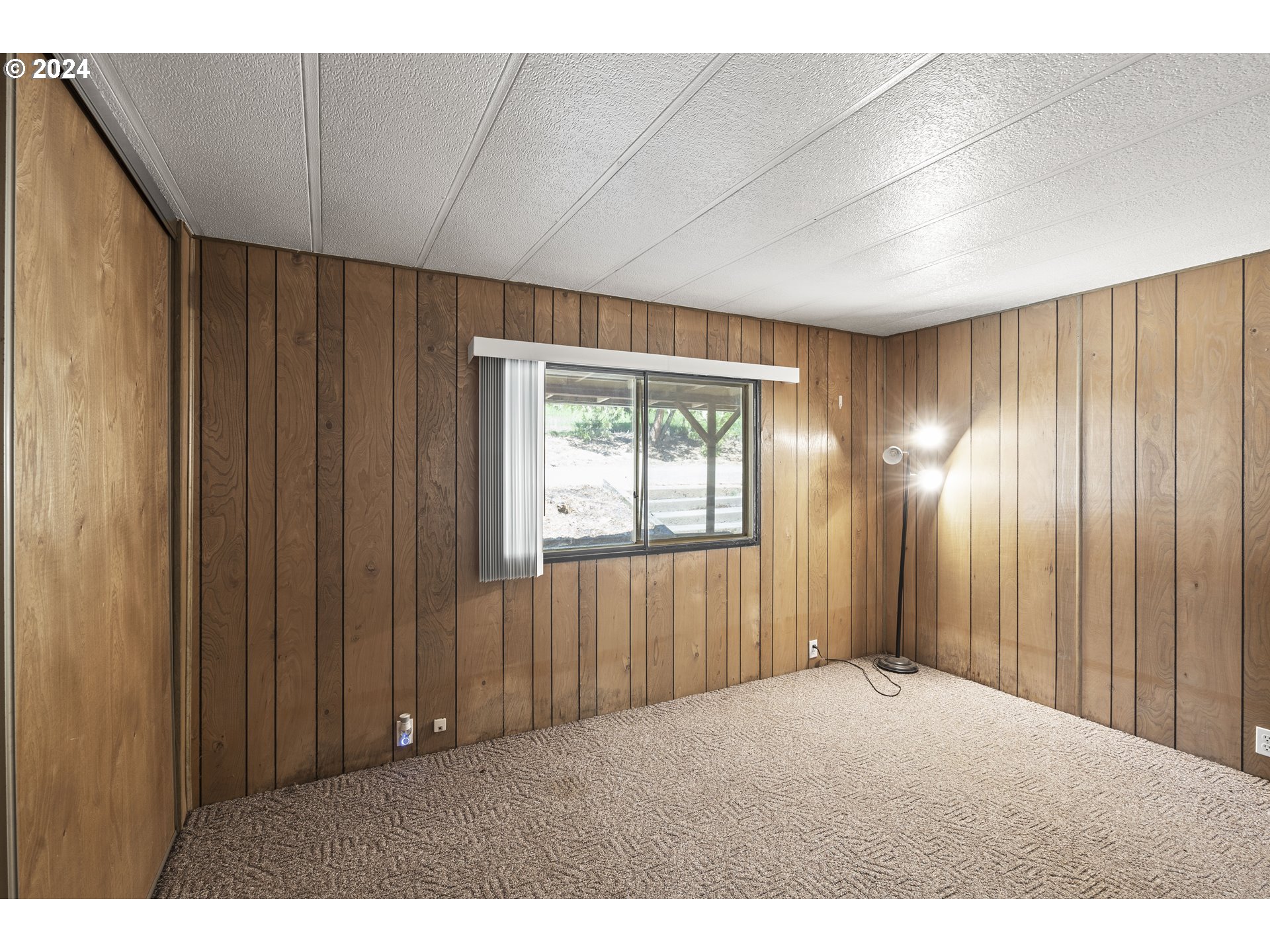 10244 North Applegate Road Grants Pass, OR 97527 - Photo 10 of 24 a view of an empty room with wooden floor