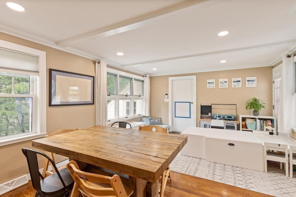 116 Quinn Road Lynn, MA 01904 - Photo 11 of 27 a living room with dining table and chairs with kitchen view