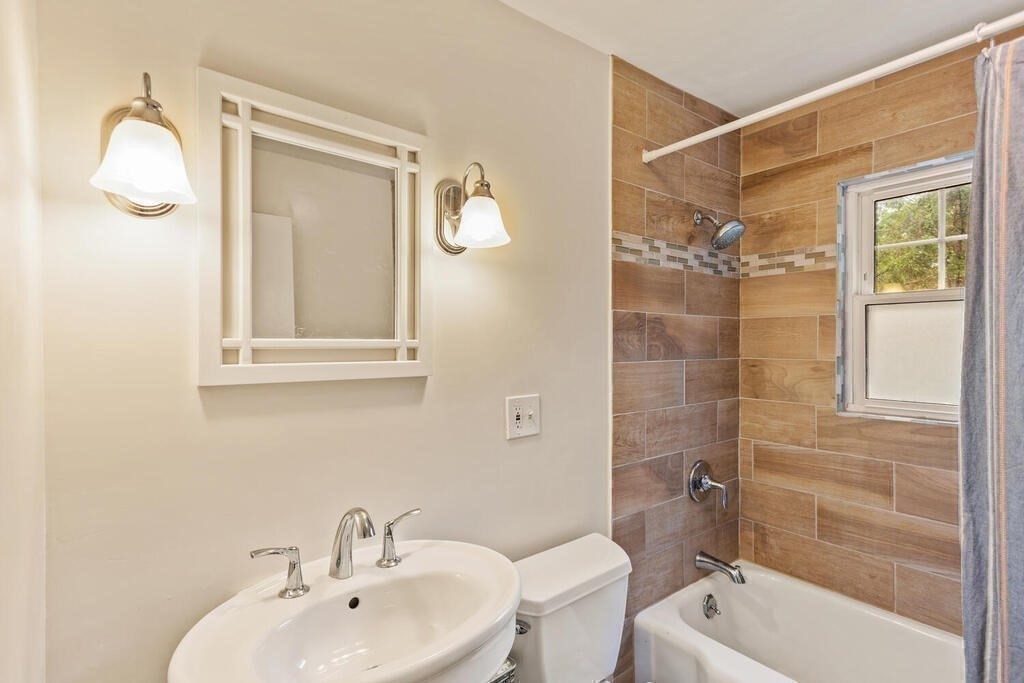 116 Quinn Road Lynn, MA 01904 - Photo 13 of 27 a bathroom with a sink a toilet and shower