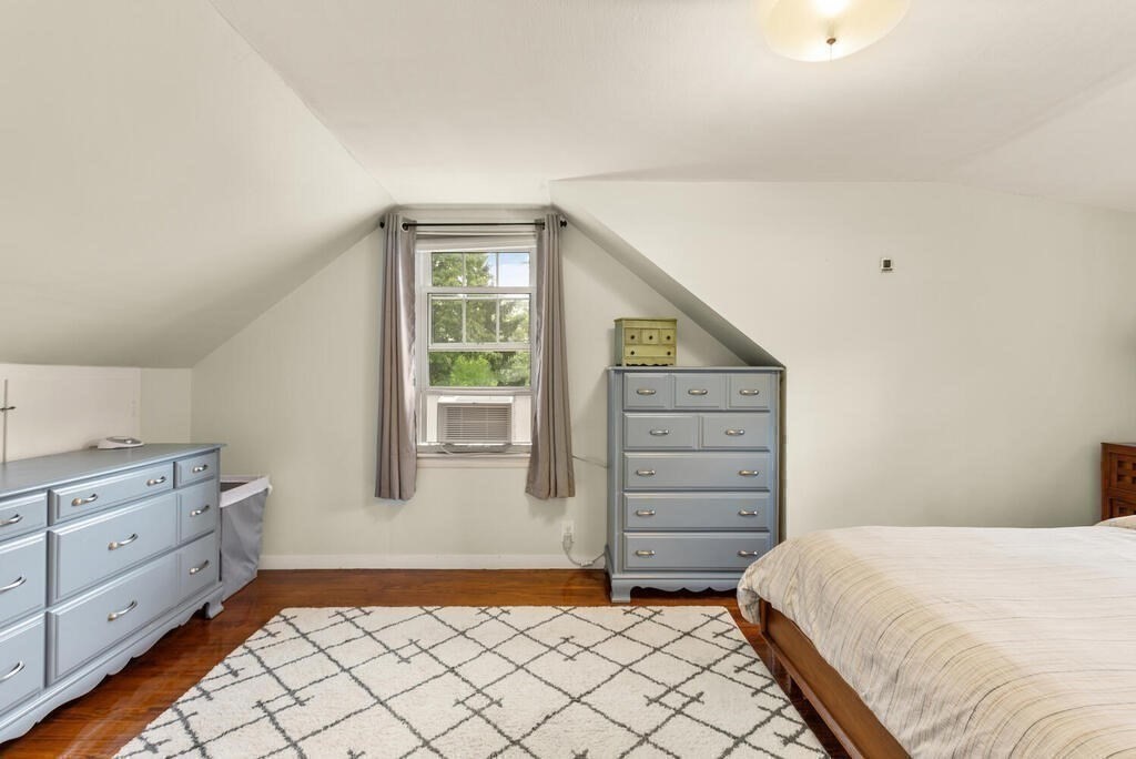 116 Quinn Road Lynn, MA 01904 - Photo 14 of 27 a bedroom with a bed and a dresser