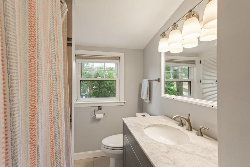 116 Quinn Road Lynn, MA 01904 - Photo 19 of 27 a bathroom with a granite countertop sink toilet and a mirror