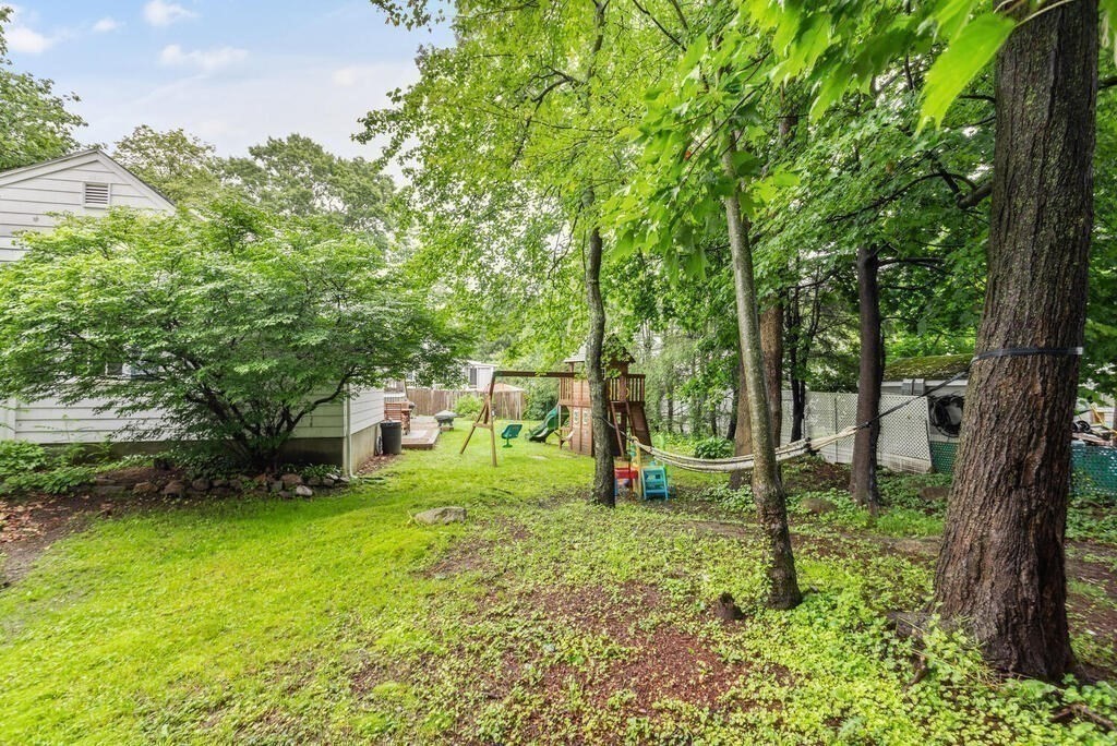 116 Quinn Road Lynn, MA 01904 - Photo 22 of 27 a view of a garden with a tree