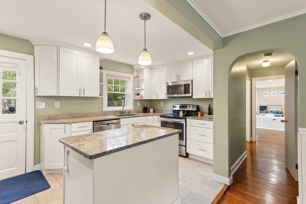 116 Quinn Road Lynn, MA 01904 - Photo 4 of 27 a kitchen with a center island appliances and cabinets