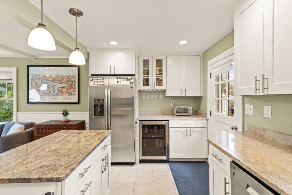 116 Quinn Road Lynn, MA 01904 - Photo 5 of 27 a large kitchen with stainless steel appliances granite countertop a stove a sink a refrigerator and a granite counter tops with white cabinets