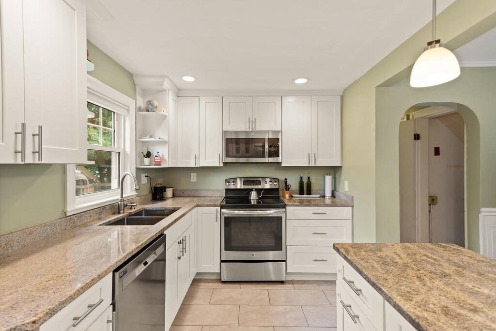 116 Quinn Road Lynn, MA 01904 - Photo 6 of 27 a kitchen with a sink stove and refrigerator
