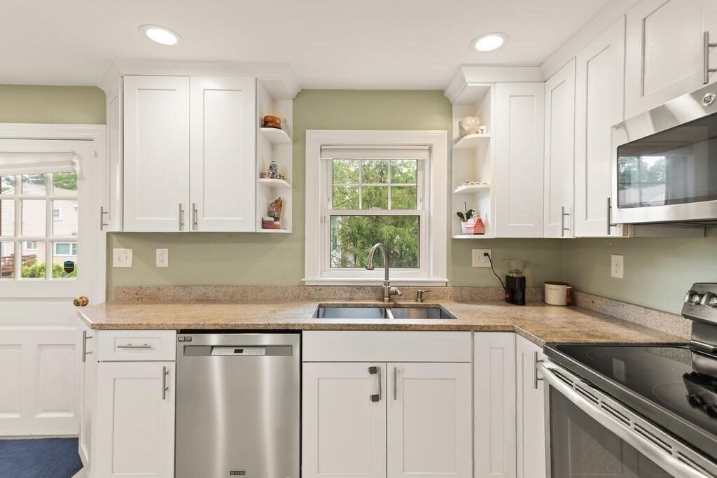 116 Quinn Road Lynn, MA 01904 - Photo 7 of 27 a kitchen with stainless steel appliances granite countertop white cabinets sink and window