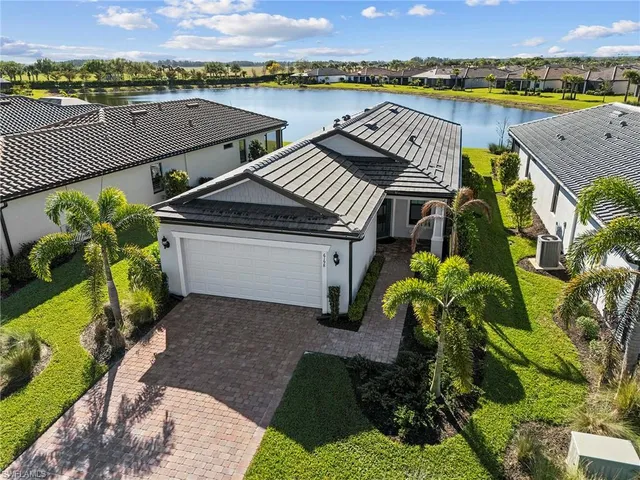 an aerial view of a house a garden and swimming pool