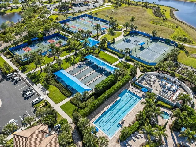 a view of swimming pool with outdoor seating and plants