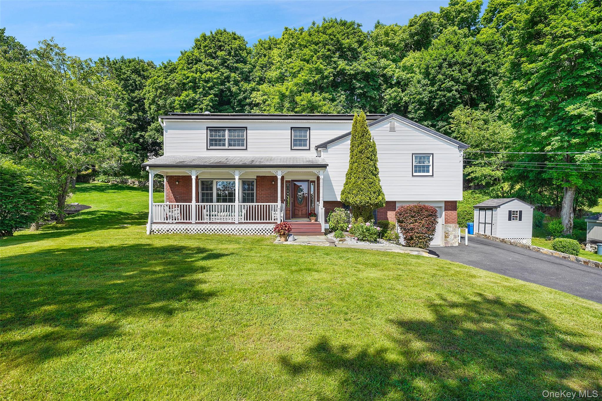 623 Cardinal Road Cortlandt Manor, NY 10567 - Photo 35 of 40 a front view of house with yard and green space