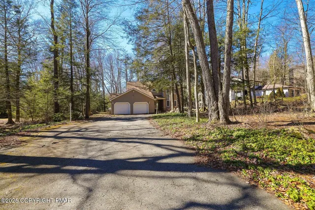 a view of swimming pool with a yard