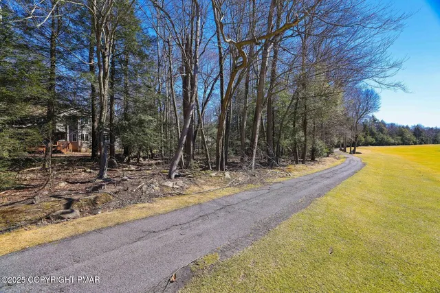 a view of a yard with swimming pool