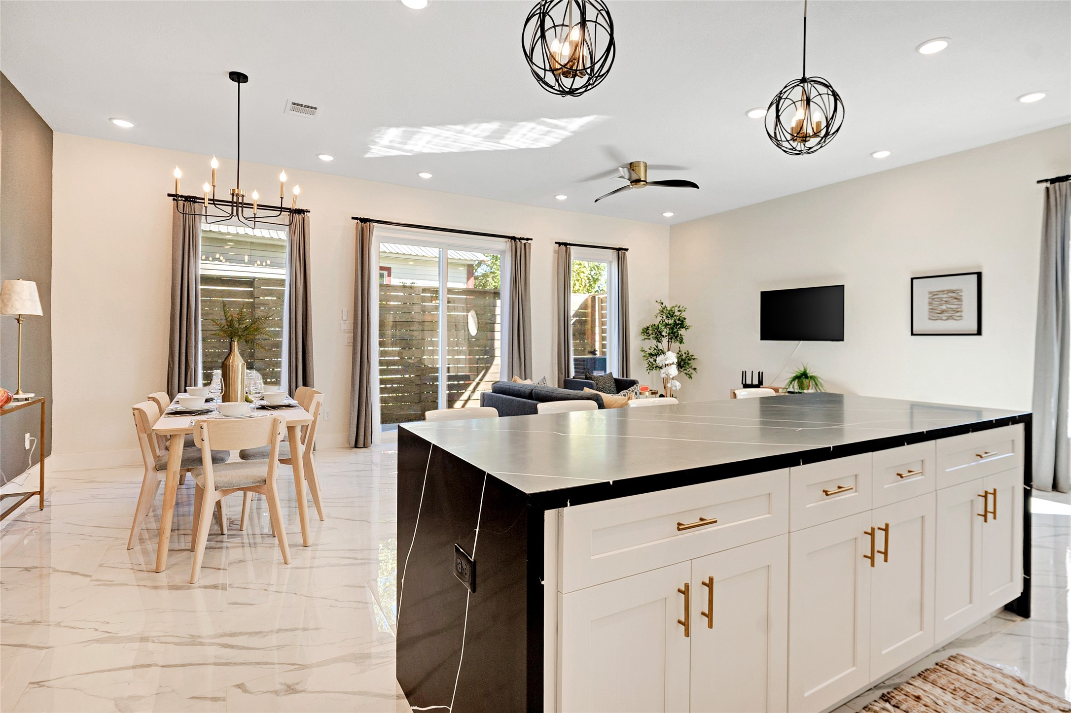 5908 St Augustine Street, Unit C Houston, TX 77021 - Photo 14 of 33 a kitchen with center island table and chairs in it