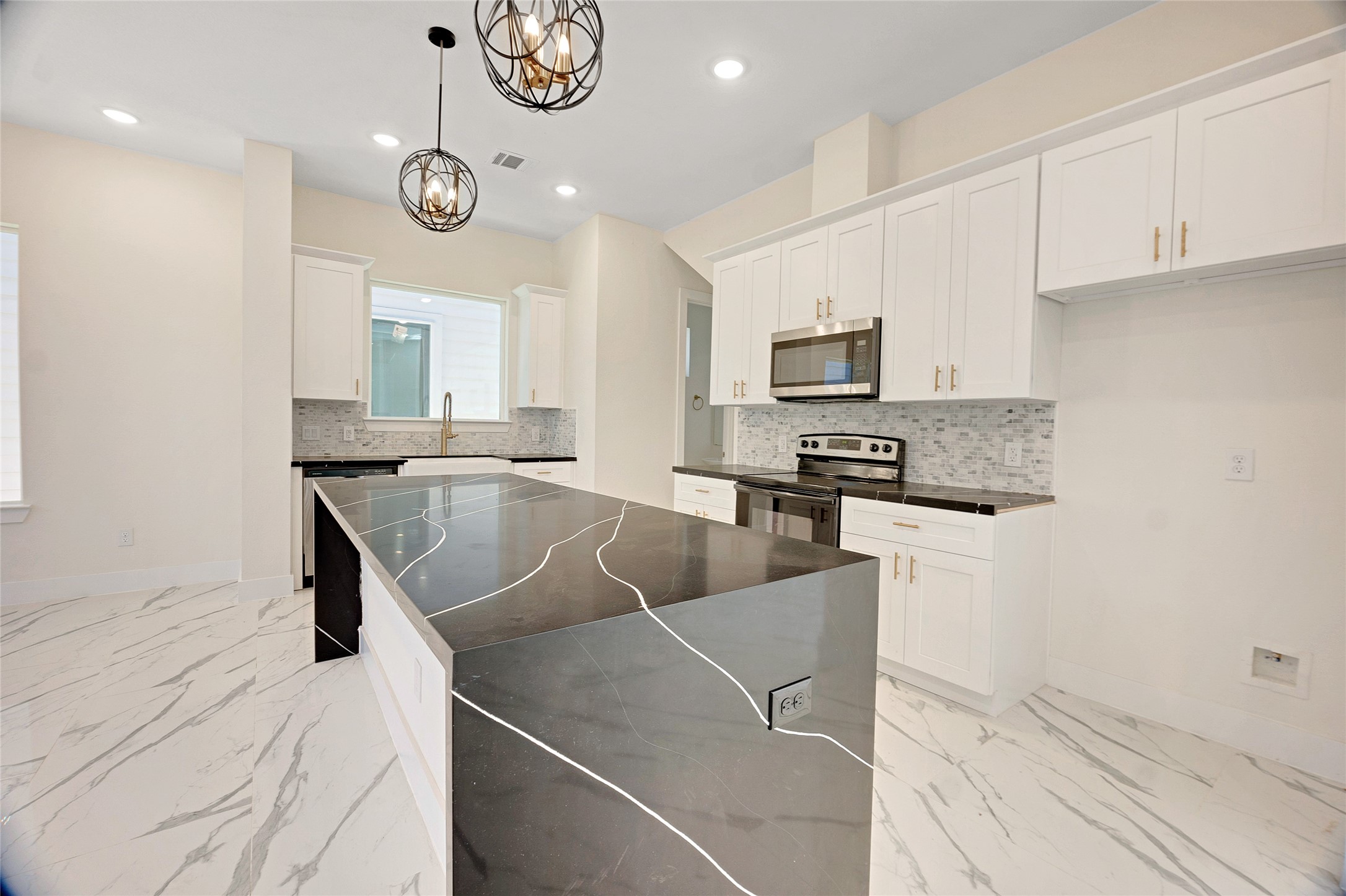 5908 St Augustine Street, Unit C Houston, TX 77021 - Photo 19 of 33 a kitchen with stainless steel appliances granite countertop a sink a stove top oven a chimney and a counter top space