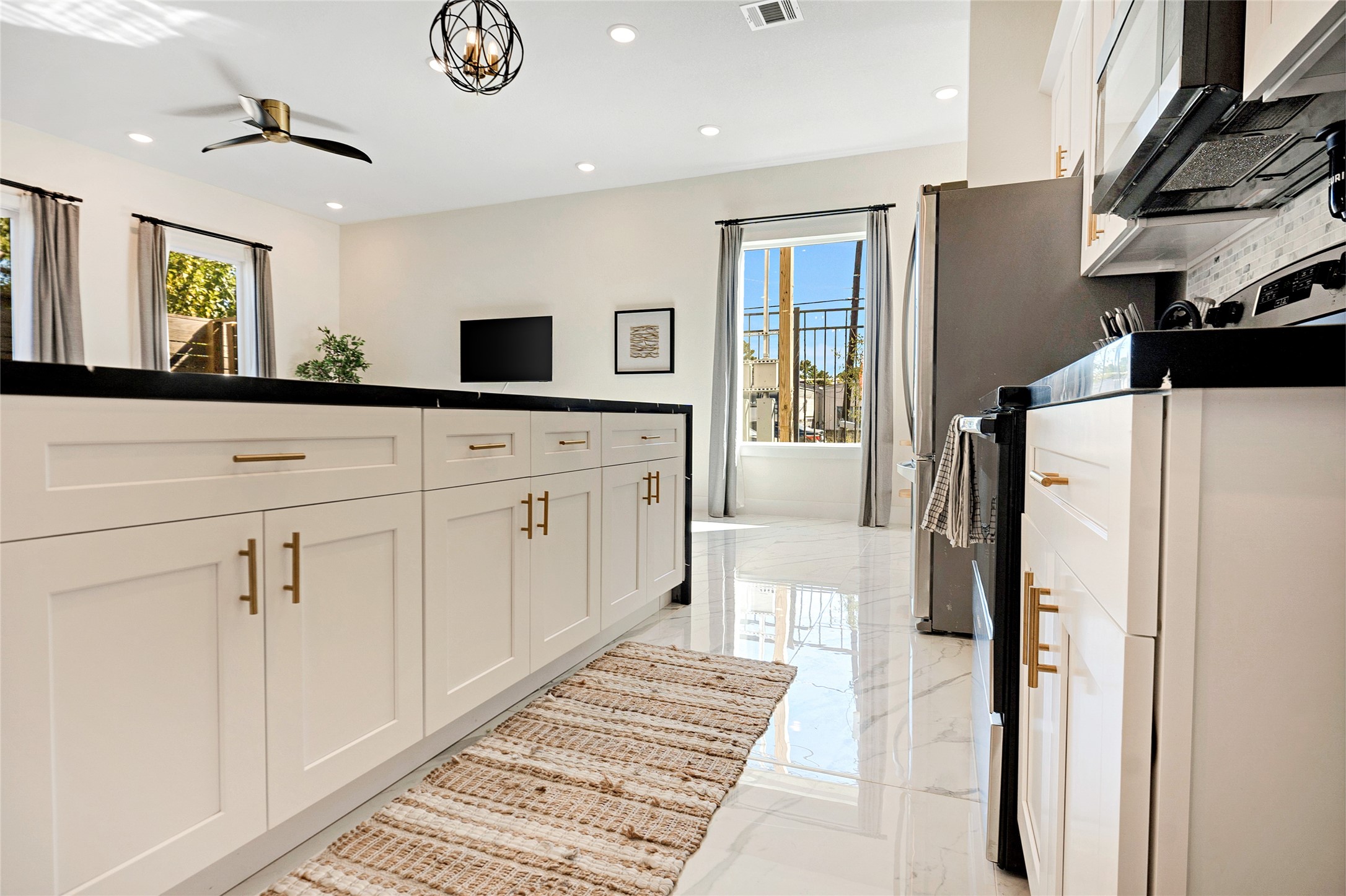 5908 St Augustine Street, Unit C Houston, TX 77021 - Photo 21 of 33 a spacious bathroom with a double vanity sink and a mirror