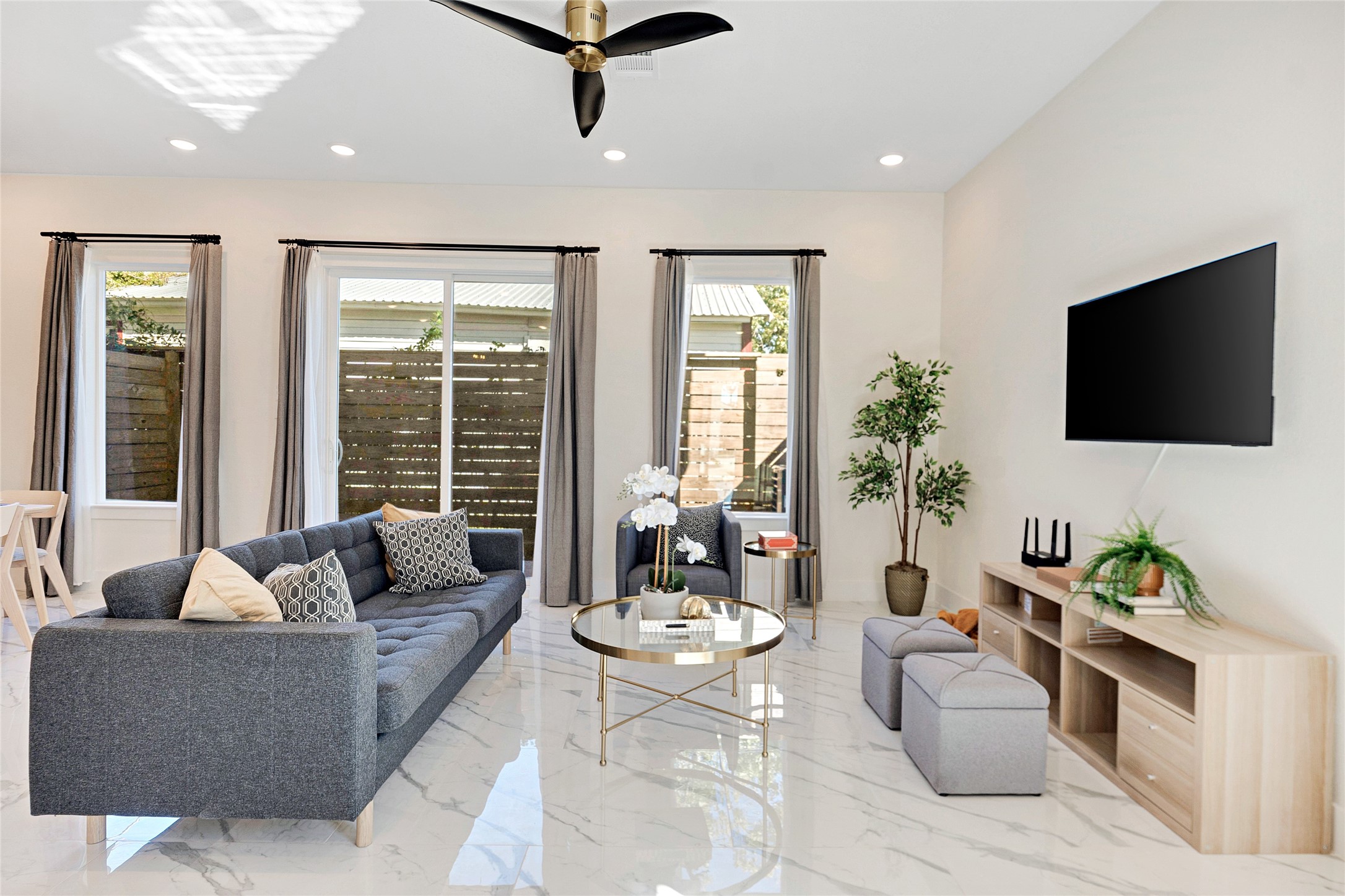 5908 St Augustine Street, Unit C Houston, TX 77021 - Photo 4 of 33 a living room with furniture and a flat screen tv