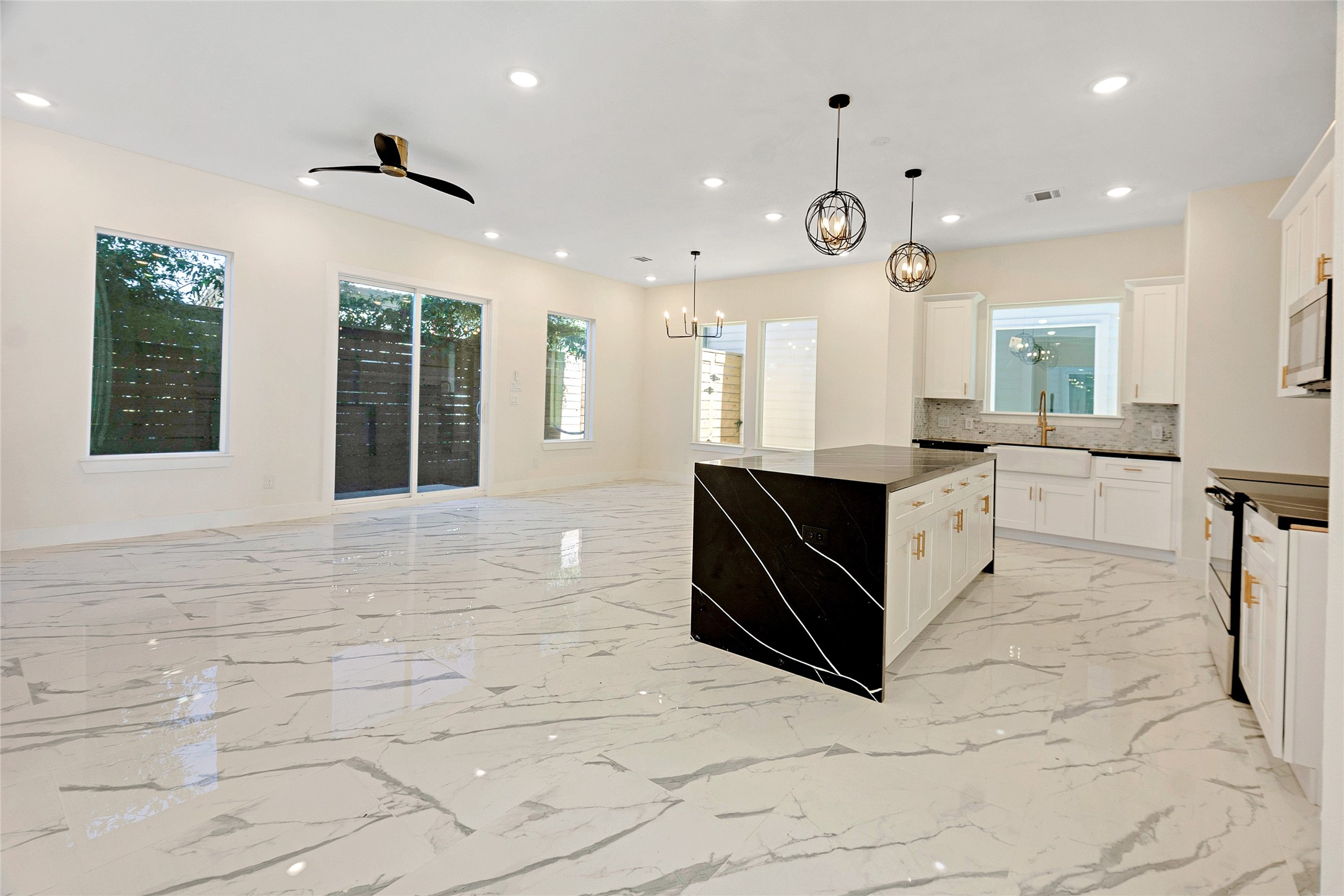 5908 St Augustine Street, Unit C Houston, TX 77021 - Photo 10 of 33 a large white kitchen with a large window