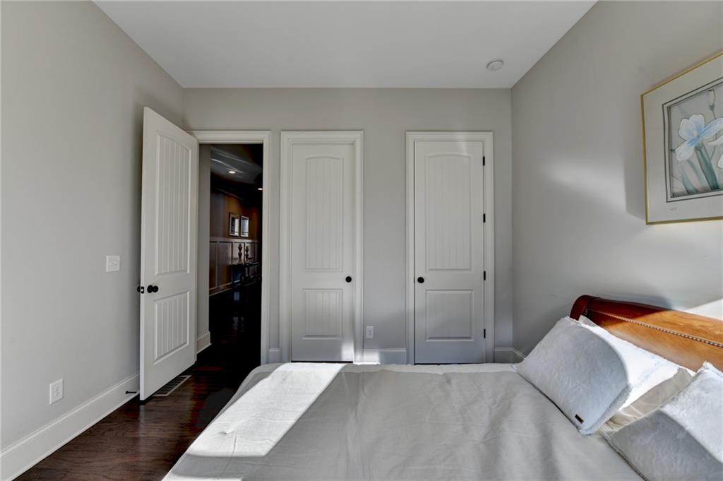 5930 Caveat Court Suwanee, GA 30024 - Photo 14 of 98 a bedroom with a bed and a painting on the wall