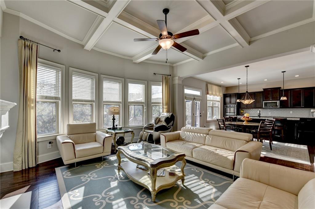 5930 Caveat Court Suwanee, GA 30024 - Photo 21 of 98 a living room with furniture ceiling fan and a large window