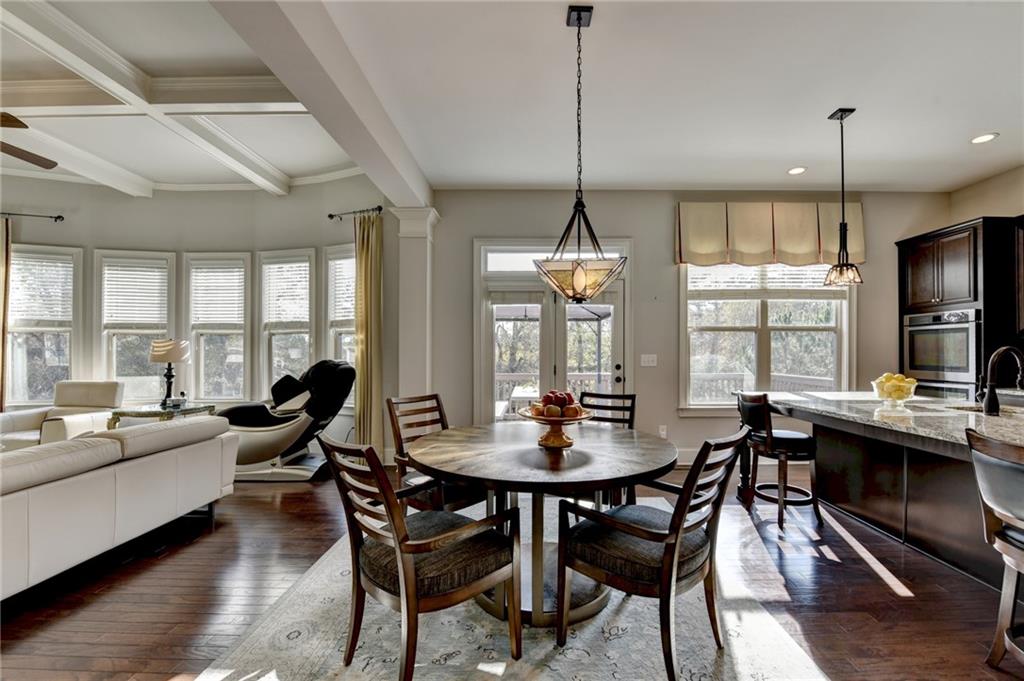 5930 Caveat Court Suwanee, GA 30024 - Photo 25 of 98 a view of a dining room with furniture window and wooden floor