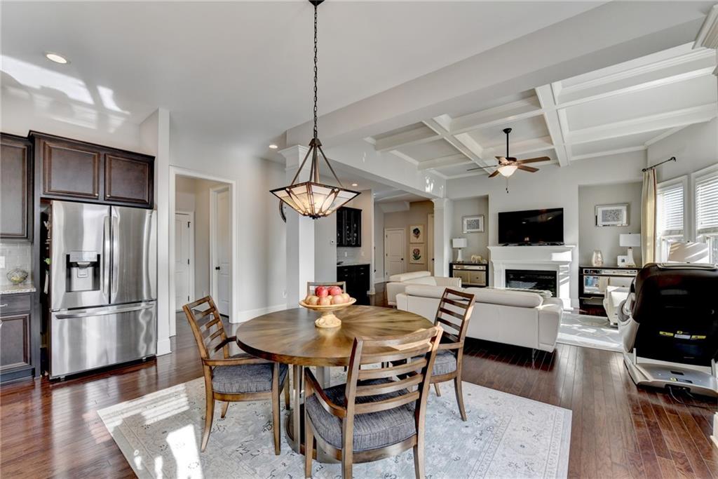 5930 Caveat Court Suwanee, GA 30024 - Photo 33 of 98 a view of a dining room with furniture wooden floor and a chandelier