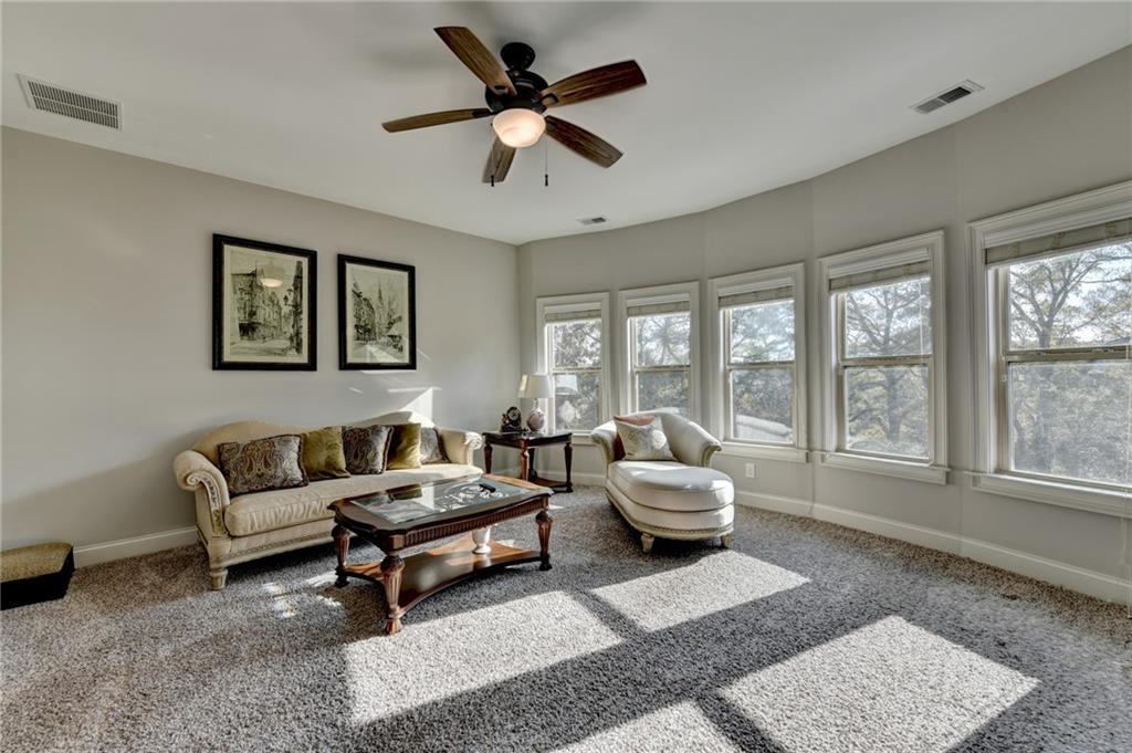 5930 Caveat Court Suwanee, GA 30024 - Photo 49 of 98 a living room with furniture and a large window