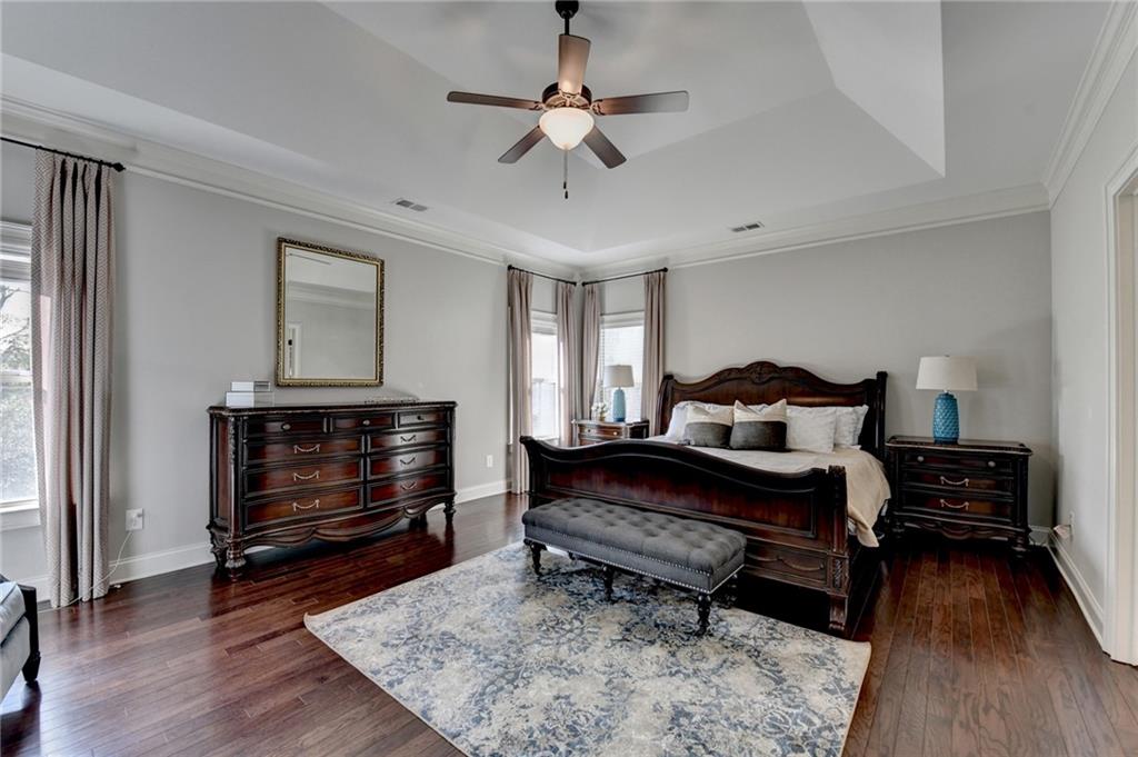 5930 Caveat Court Suwanee, GA 30024 - Photo 53 of 98 a bedroom with furniture and a fireplace