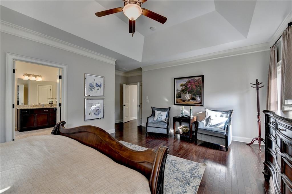 5930 Caveat Court Suwanee, GA 30024 - Photo 55 of 98 a bedroom with furniture and a wooden floor