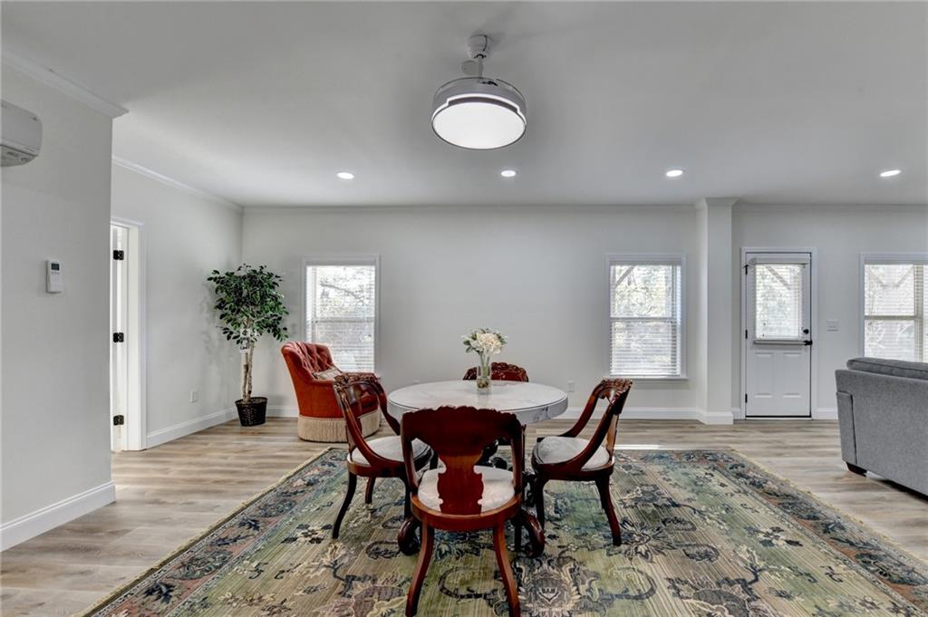 5930 Caveat Court Suwanee, GA 30024 - Photo 65 of 98 a view of a dining room with furniture and window
