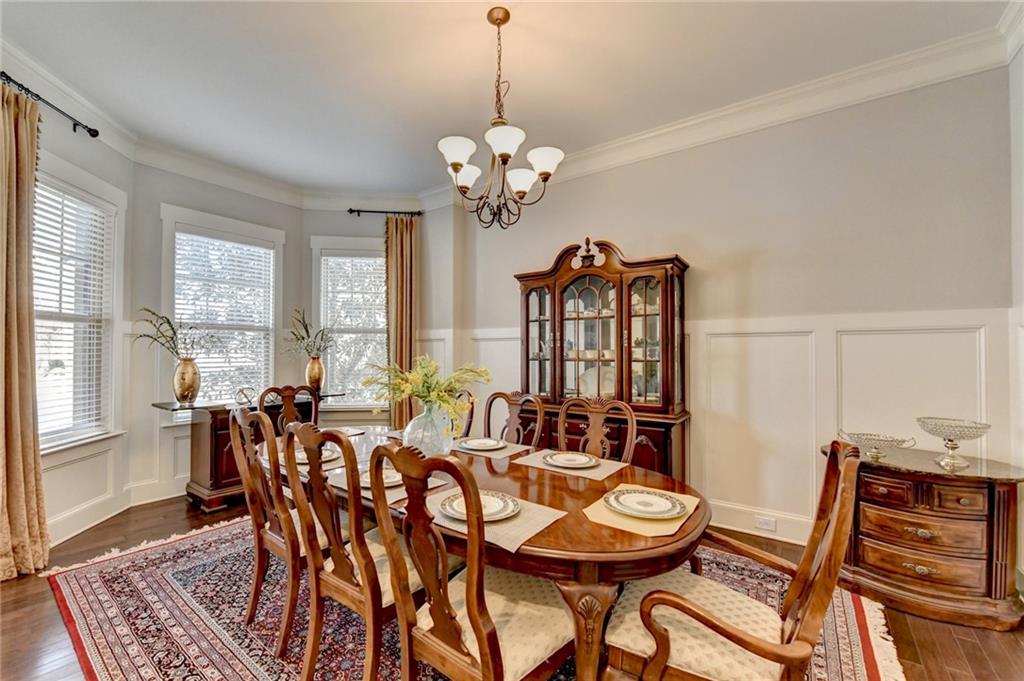 5930 Caveat Court Suwanee, GA 30024 - Photo 7 of 98 a view of a dining room with furniture window and wooden floor