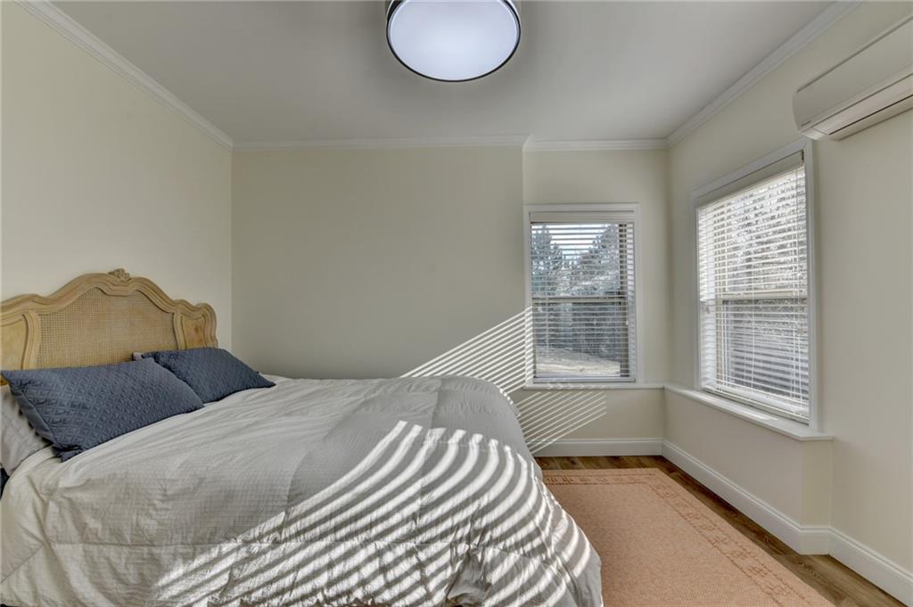 5930 Caveat Court Suwanee, GA 30024 - Photo 72 of 98 a bedroom with a bed and a window