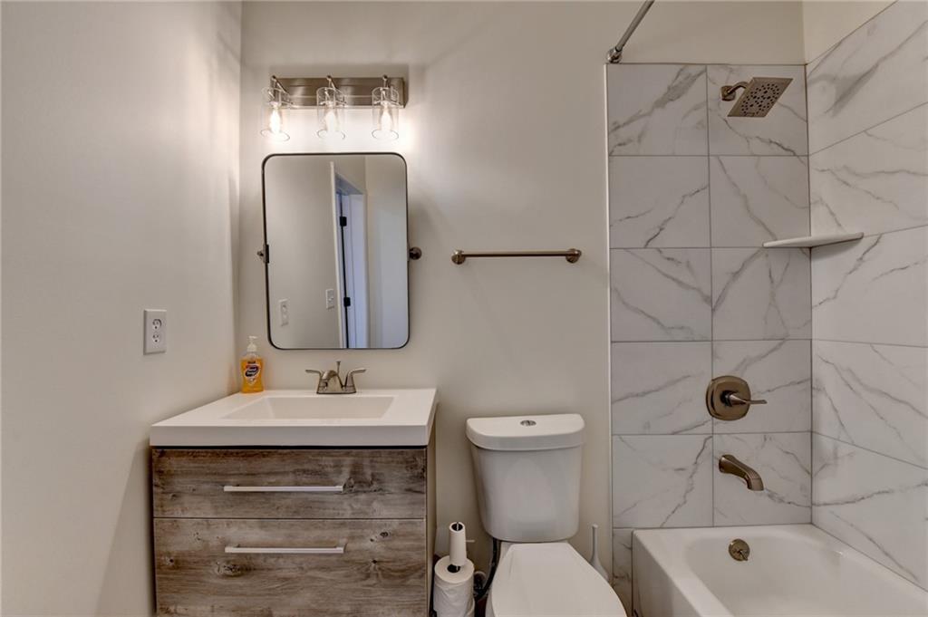5930 Caveat Court Suwanee, GA 30024 - Photo 75 of 98 a bathroom with a sink vanity mirror and toilet
