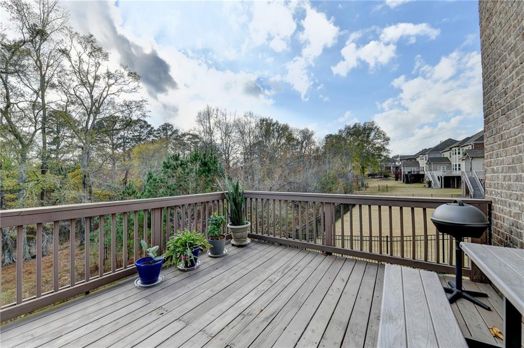 5930 Caveat Court Suwanee, GA 30024 - Photo 78 of 98 a view of balcony with furniture and wooden floor