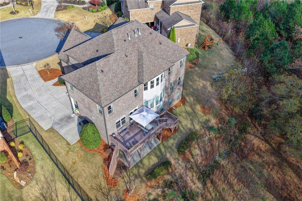 5930 Caveat Court Suwanee, GA 30024 - Photo 88 of 98 an aerial view of a house with a yard