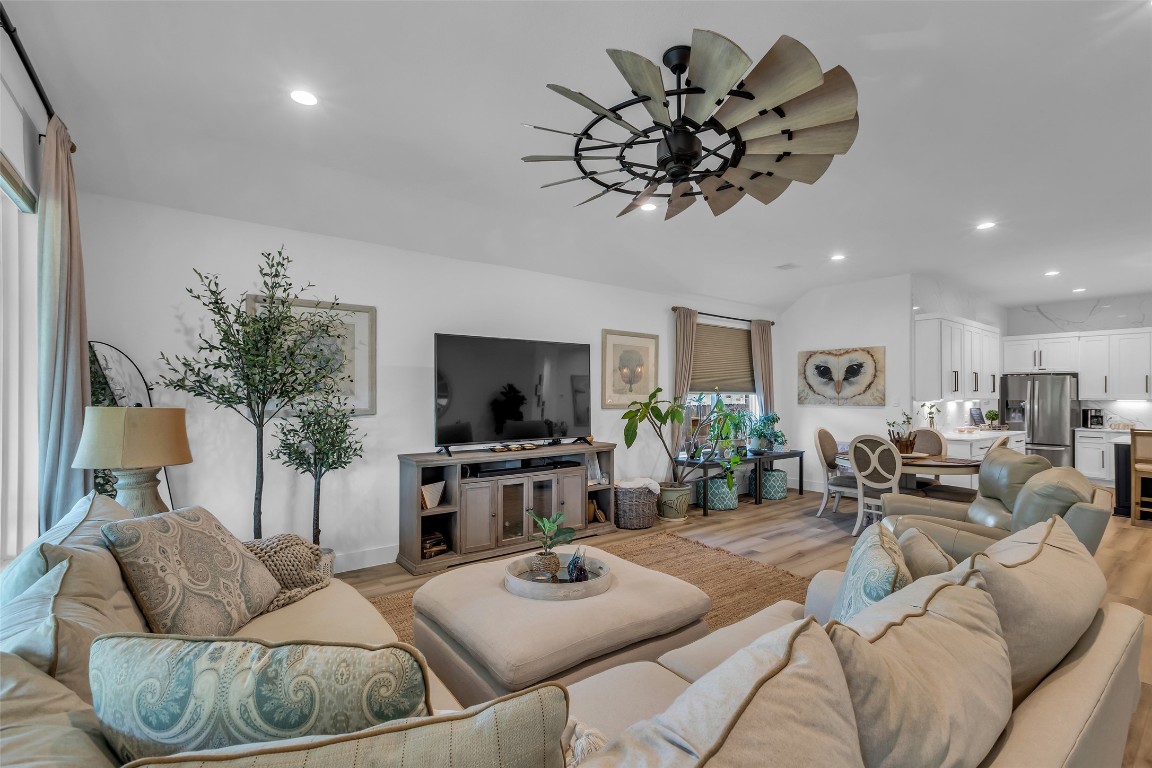 307 Springfield Terrace Drive Conroe, TX 77304 - Photo 14 of 30 a living room with furniture a window and a flat screen tv