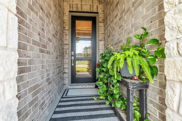 a view of a kitchen and a hallway