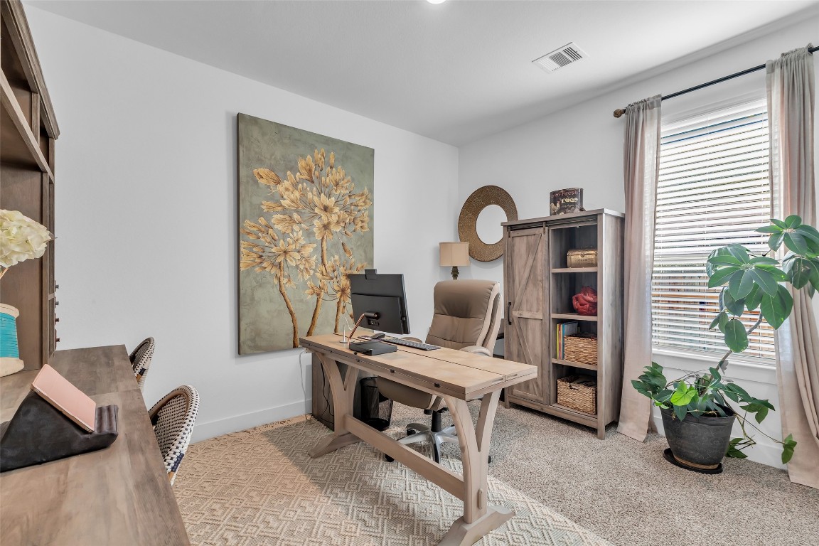307 Springfield Terrace Drive Conroe, TX 77304 - Photo 22 of 30 a workspace with furniture and a potted plant