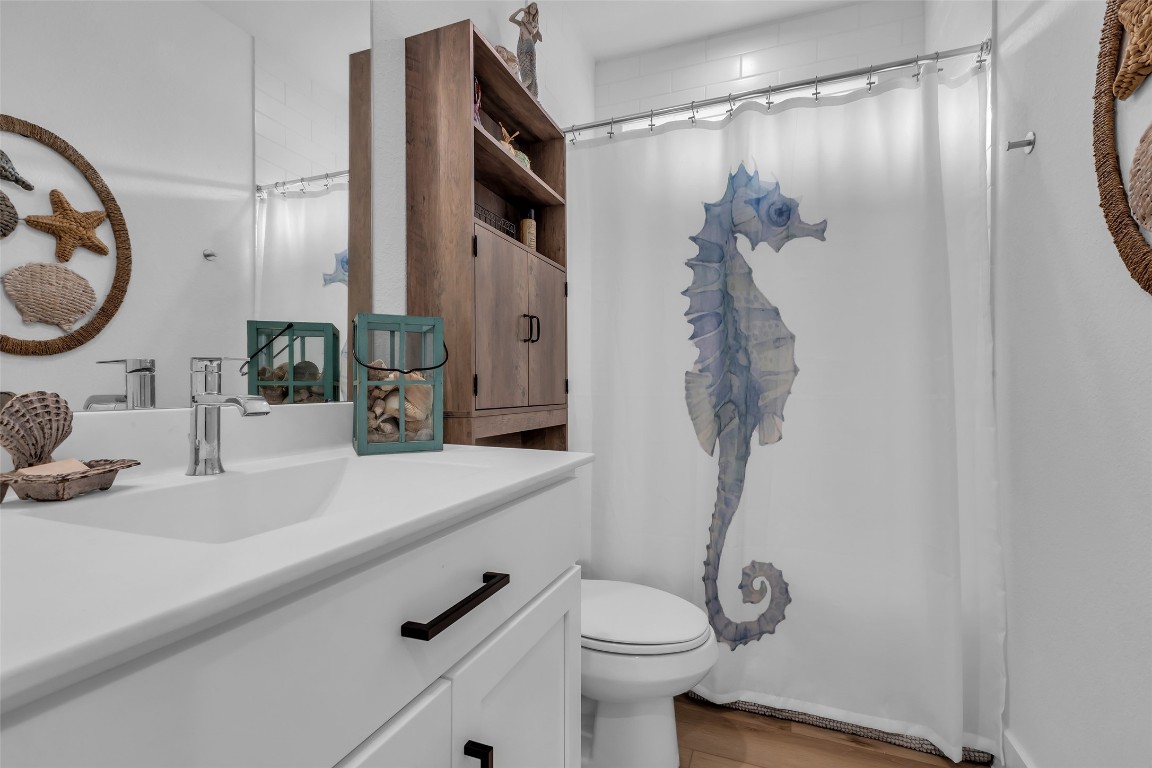 307 Springfield Terrace Drive Conroe, TX 77304 - Photo 23 of 30 a bathroom with a sink a toilet and shower