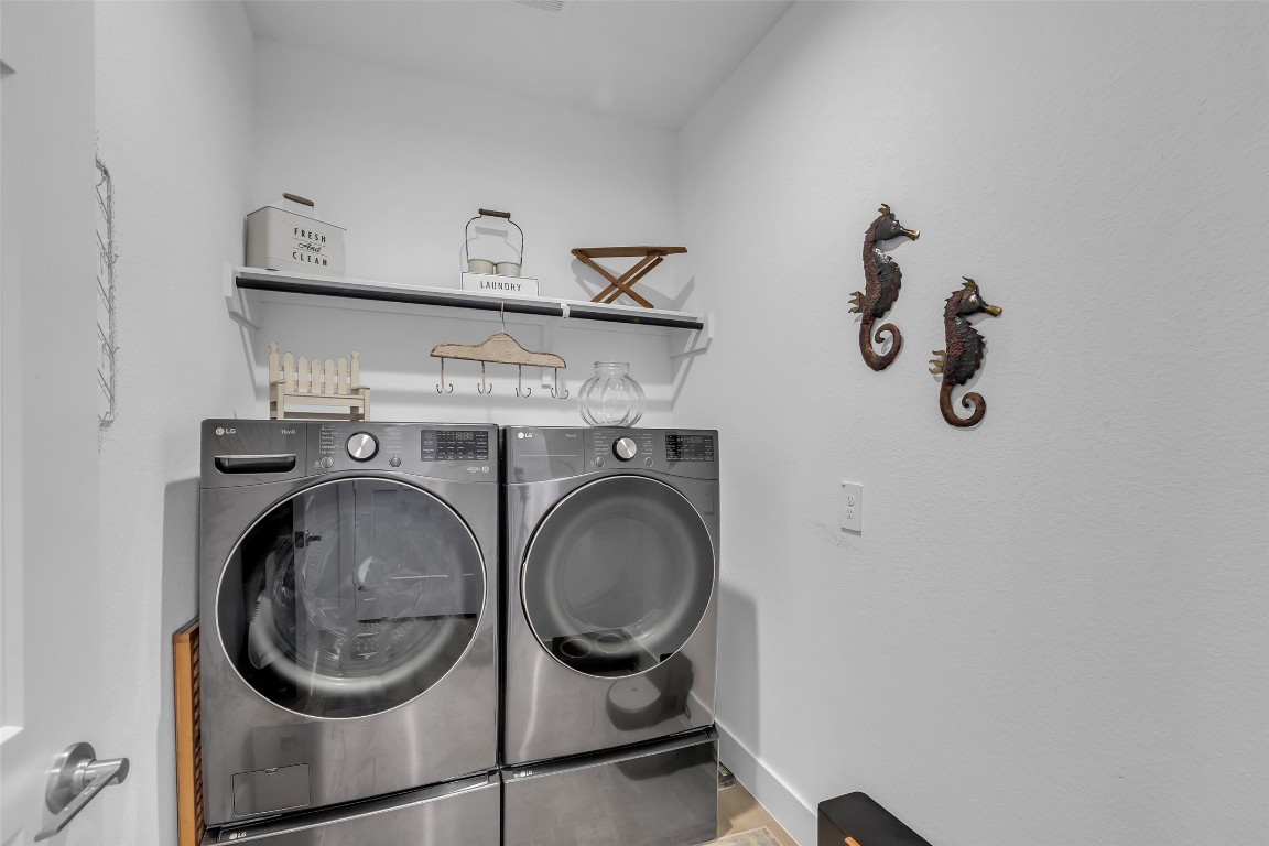 307 Springfield Terrace Drive Conroe, TX 77304 - Photo 25 of 30 a utility room with dryer and washer