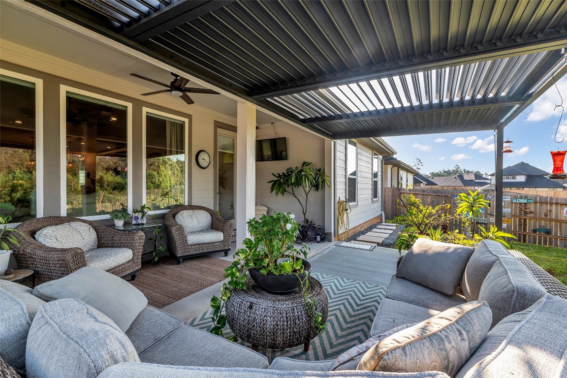 307 Springfield Terrace Drive Conroe, TX 77304 - Photo 28 of 30 a outdoor living space with furniture and a large window