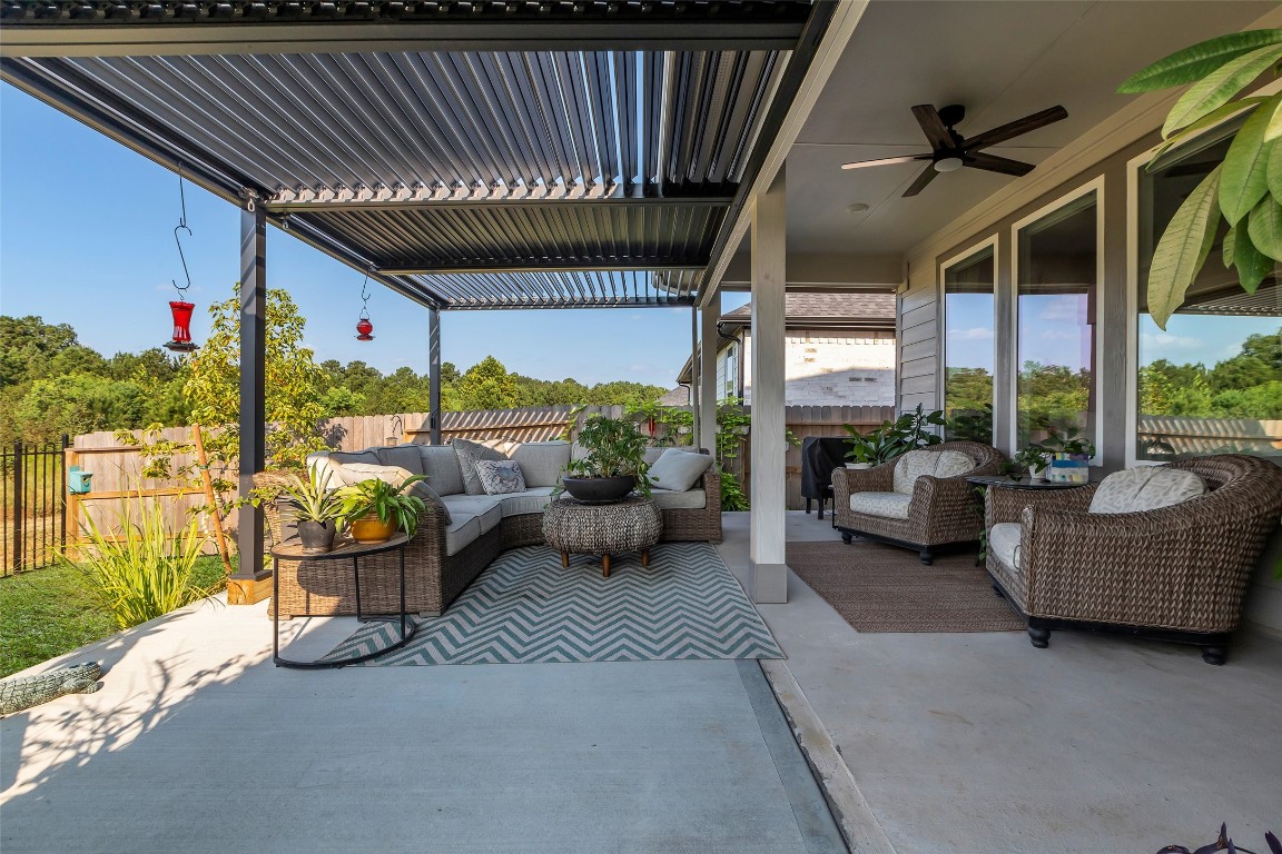 307 Springfield Terrace Drive Conroe, TX 77304 - Photo 29 of 30 a building outdoor space with patio furniture and potted plants