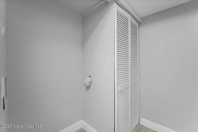 a bathroom with a shower and a window