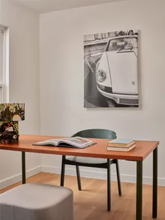 a view of room with furniture and wooden floor