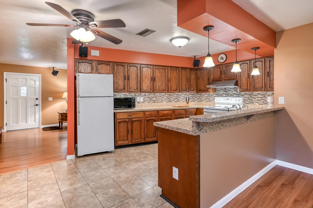 336 Lobelia Road St. Augustine, FL 32086 - Photo 12 of 46 a kitchen with kitchen island a counter top space appliances and cabinets